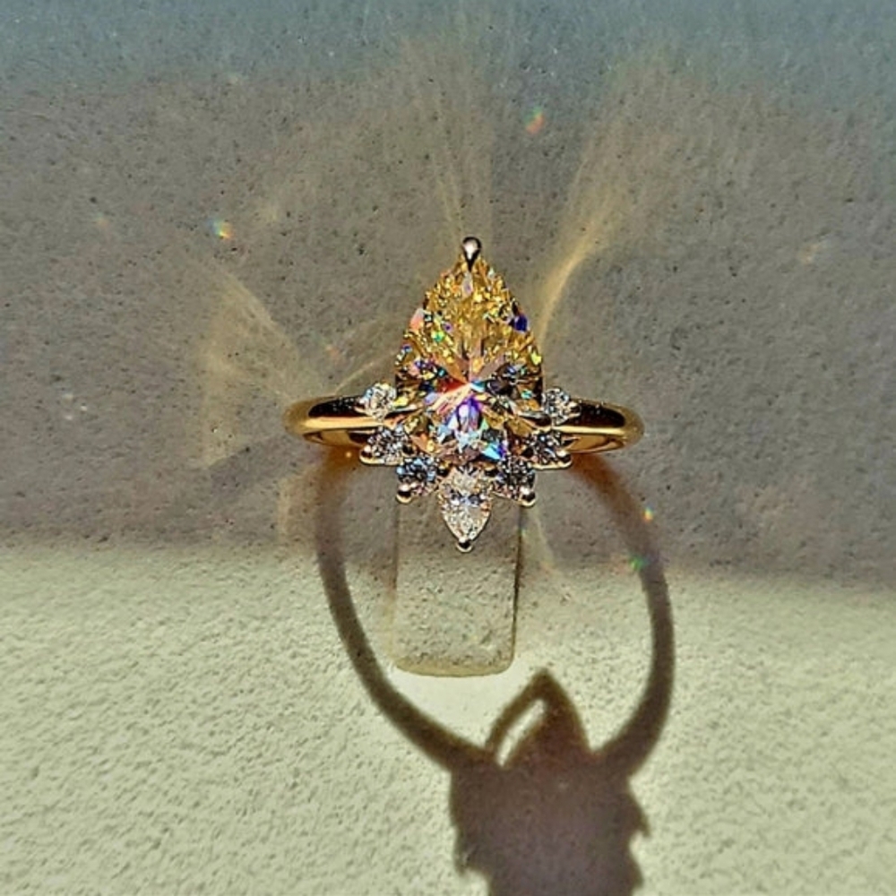 Solid 18k gold 2ct light champagne pear moissanite ring with side moissanite